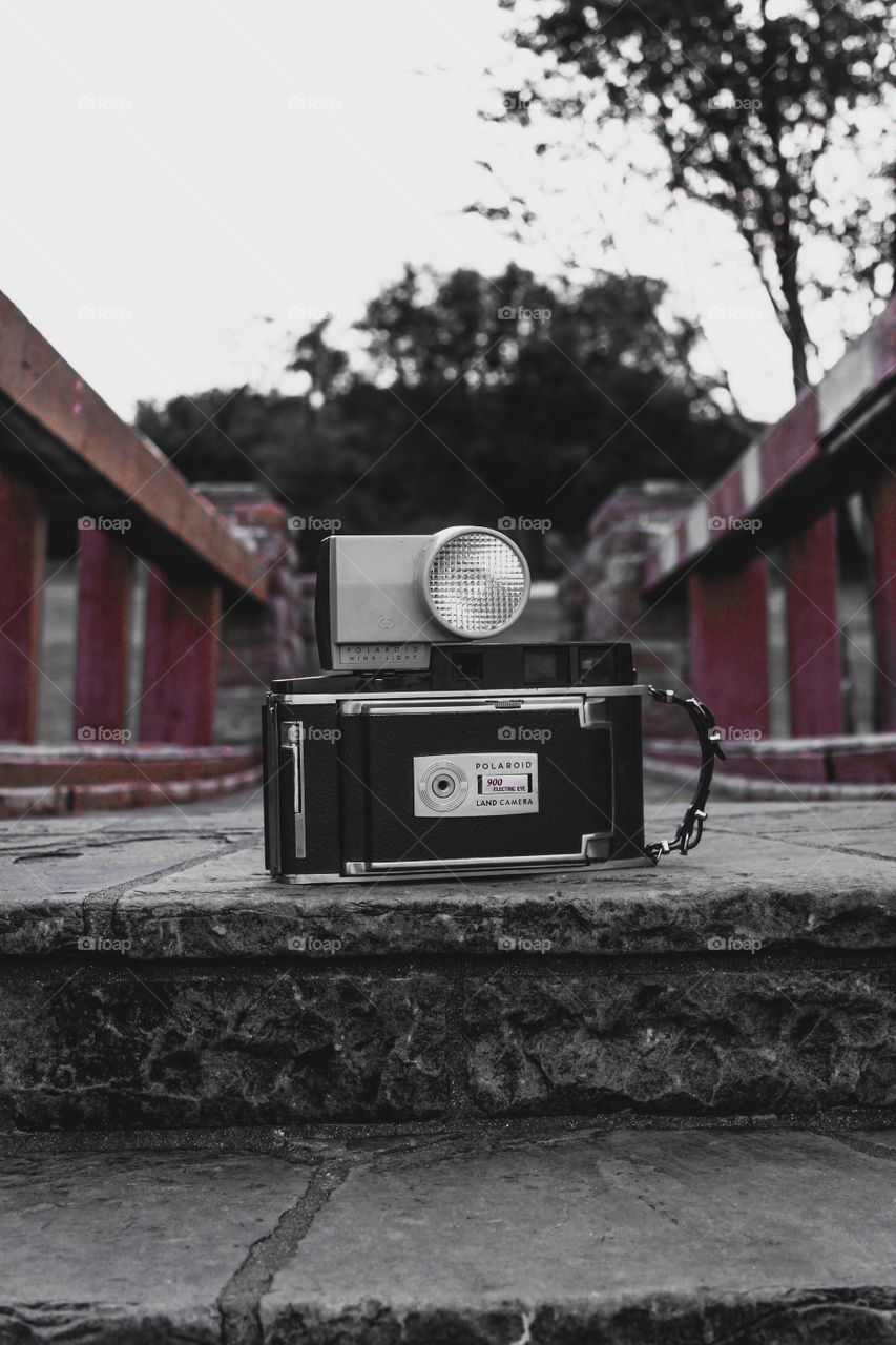 Vintage camera on a bridge