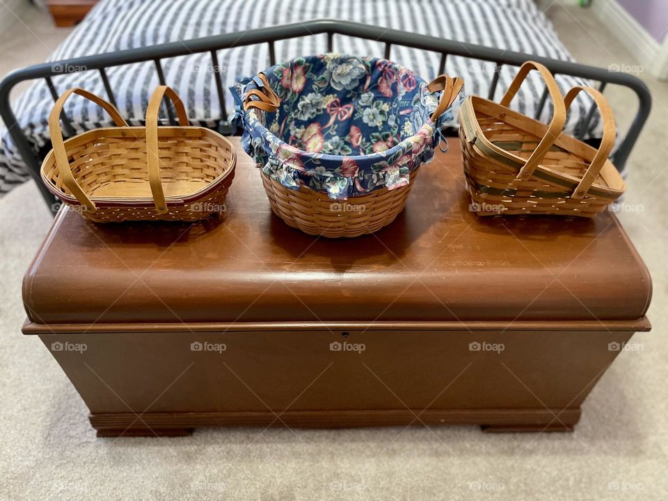Longaberger baskets on a cedar chest, using Longaberger baskets for gift baskets, making gifts from Longaberger baskets 