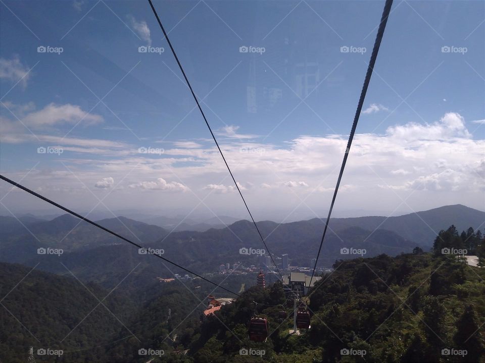 The view of the mountains with the cable cars.
