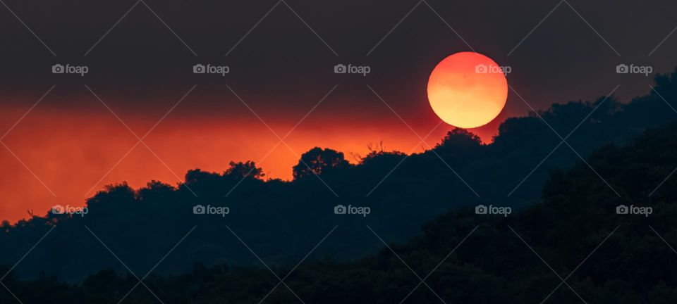 Sunset in a smoke filled sky during wildfires in Portugal during the summer 2022 heatwave 