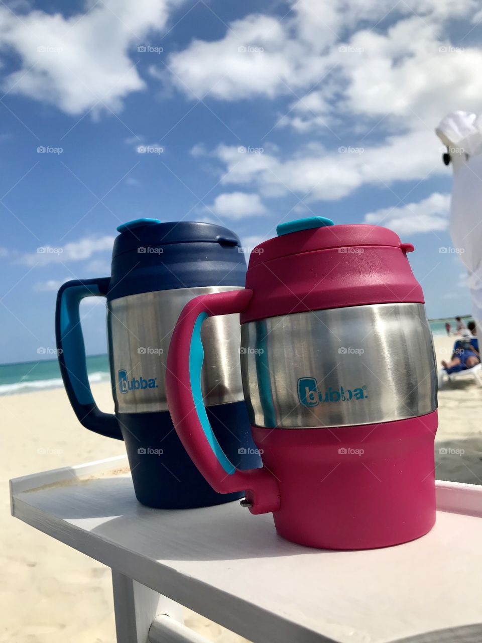 2 Bubba mugs on a beach in Cuba