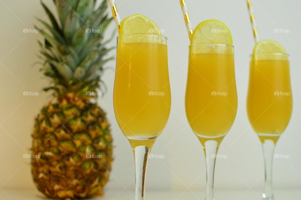 three glasses of pineapple juice
