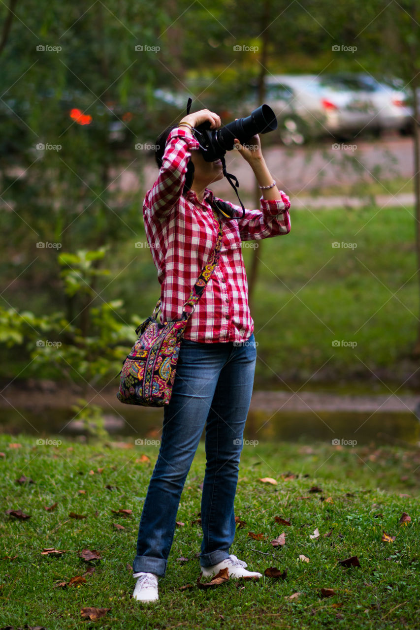 Woman taking pictures on camera