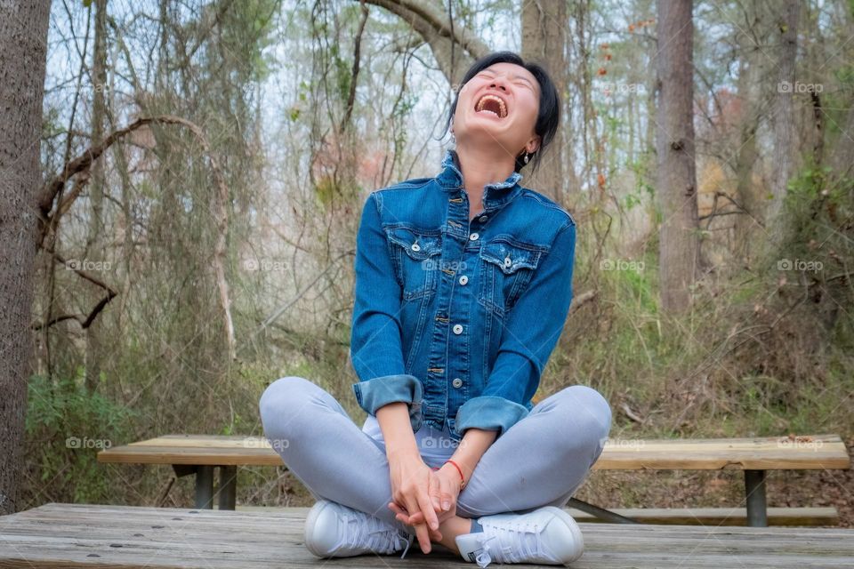 A Taiwanese lady lost in laughter. 