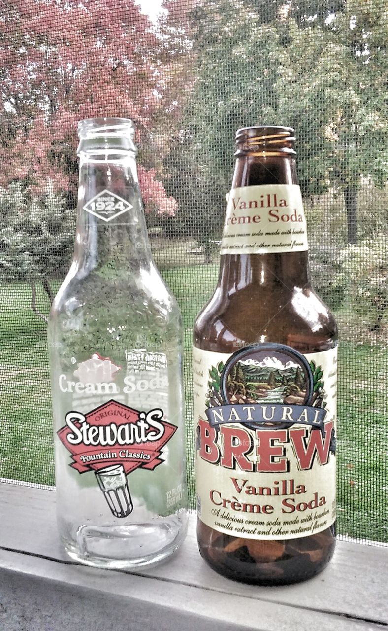 Mmmm cream soda. two empty soda bottles for an intersting picture.