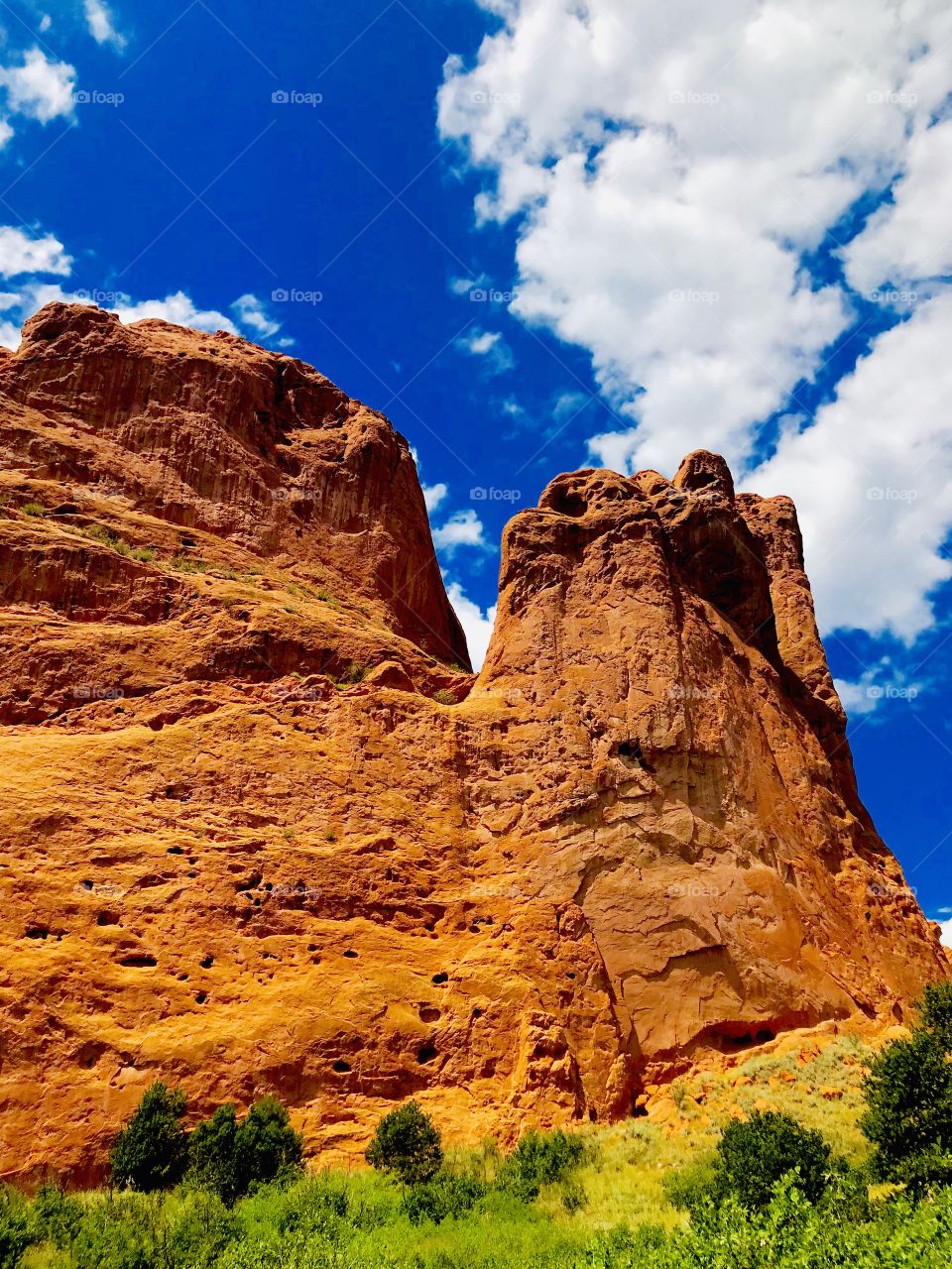 Rock formation at garden of the gods in Colorado Springs on a beautiful summer afternoon. Garden of the gods is the perfect place for a hike, walk, bike, run and they even have rock climbing spots available. Beautiful place to enjoy the outdoors.