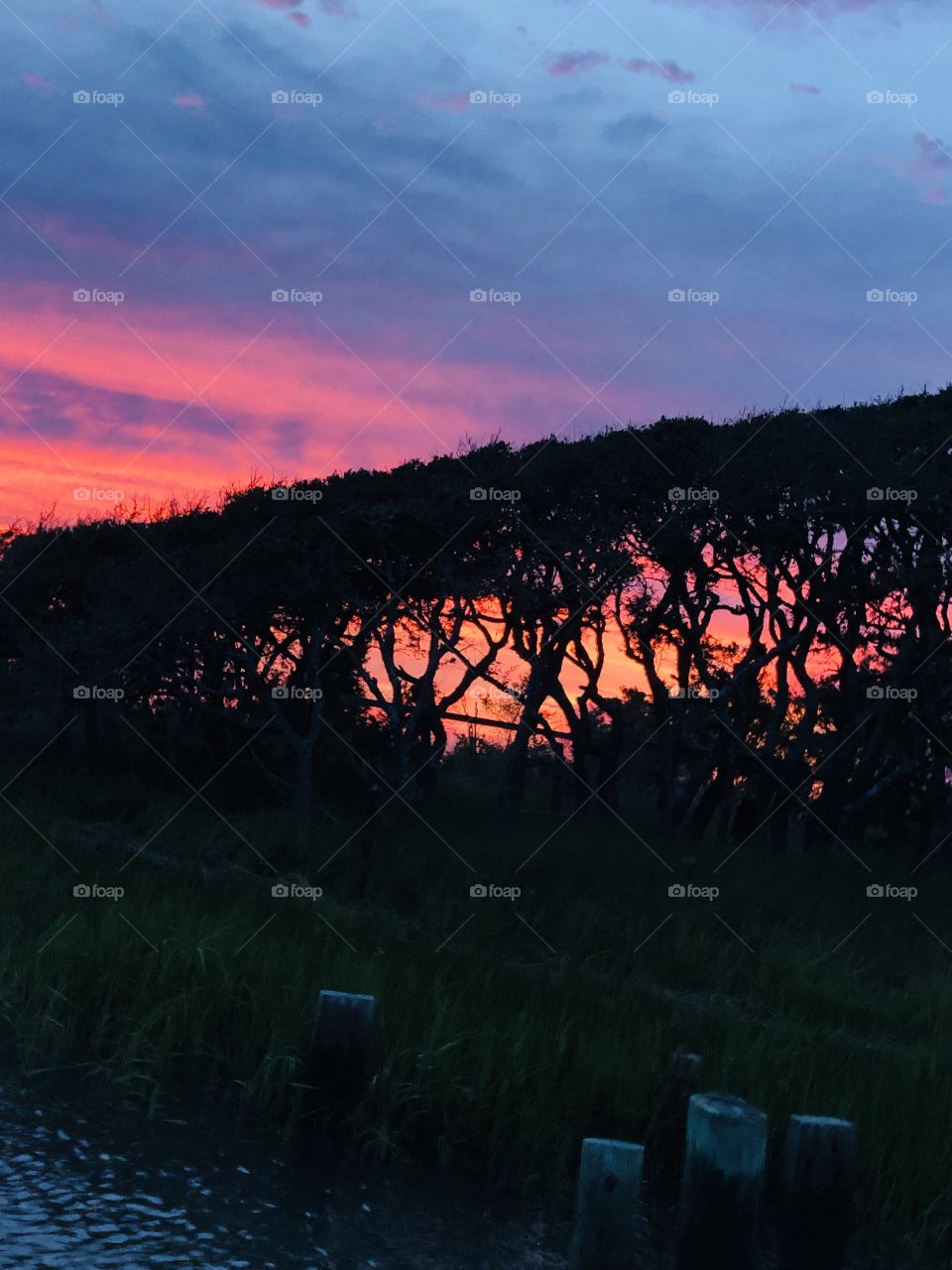 Crystal coast NC sunset on the river old dock with a island so beautiful 