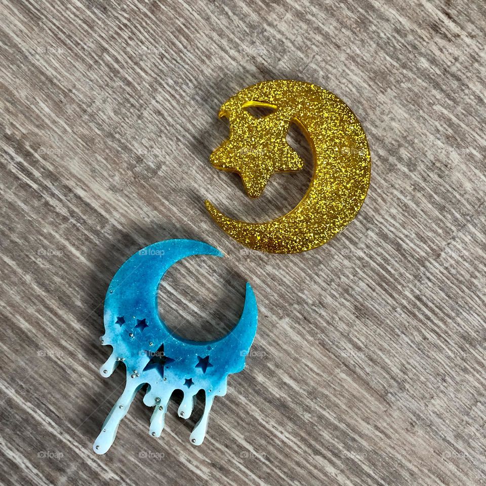 The first 2 things I made using resin - moon shaped fridge magnets 