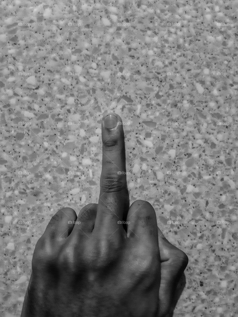 A middle finger is used as a symbol of rudeness. It means "fuck you!"