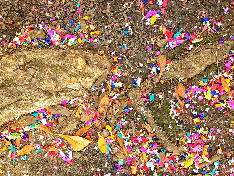 Brilliant colorful confetti littering the ground