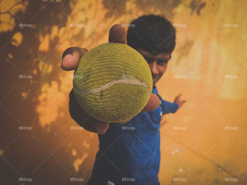 Boy showing his tennis ball 🎾