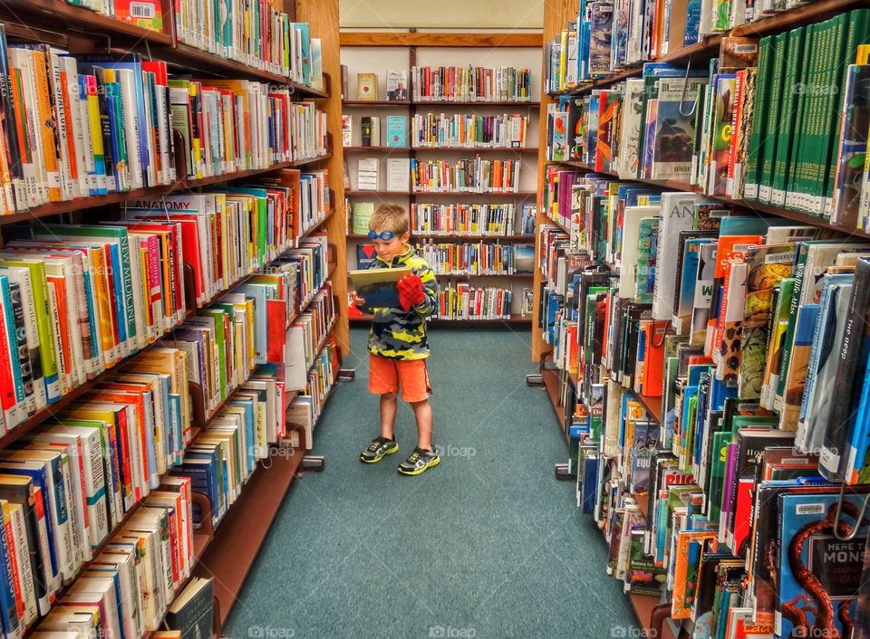 Young Boy In A Library