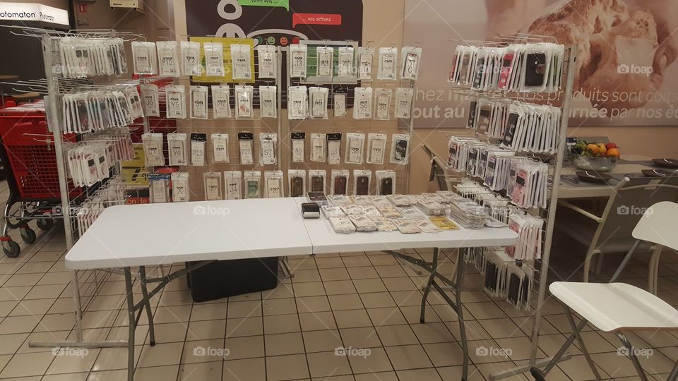 View of a phone case stand in a supermarket in Auvergne France