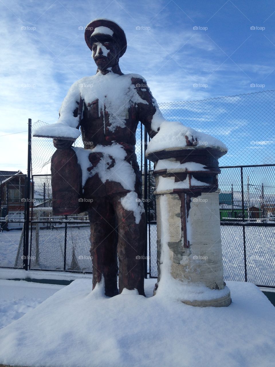 Postman statue frozen