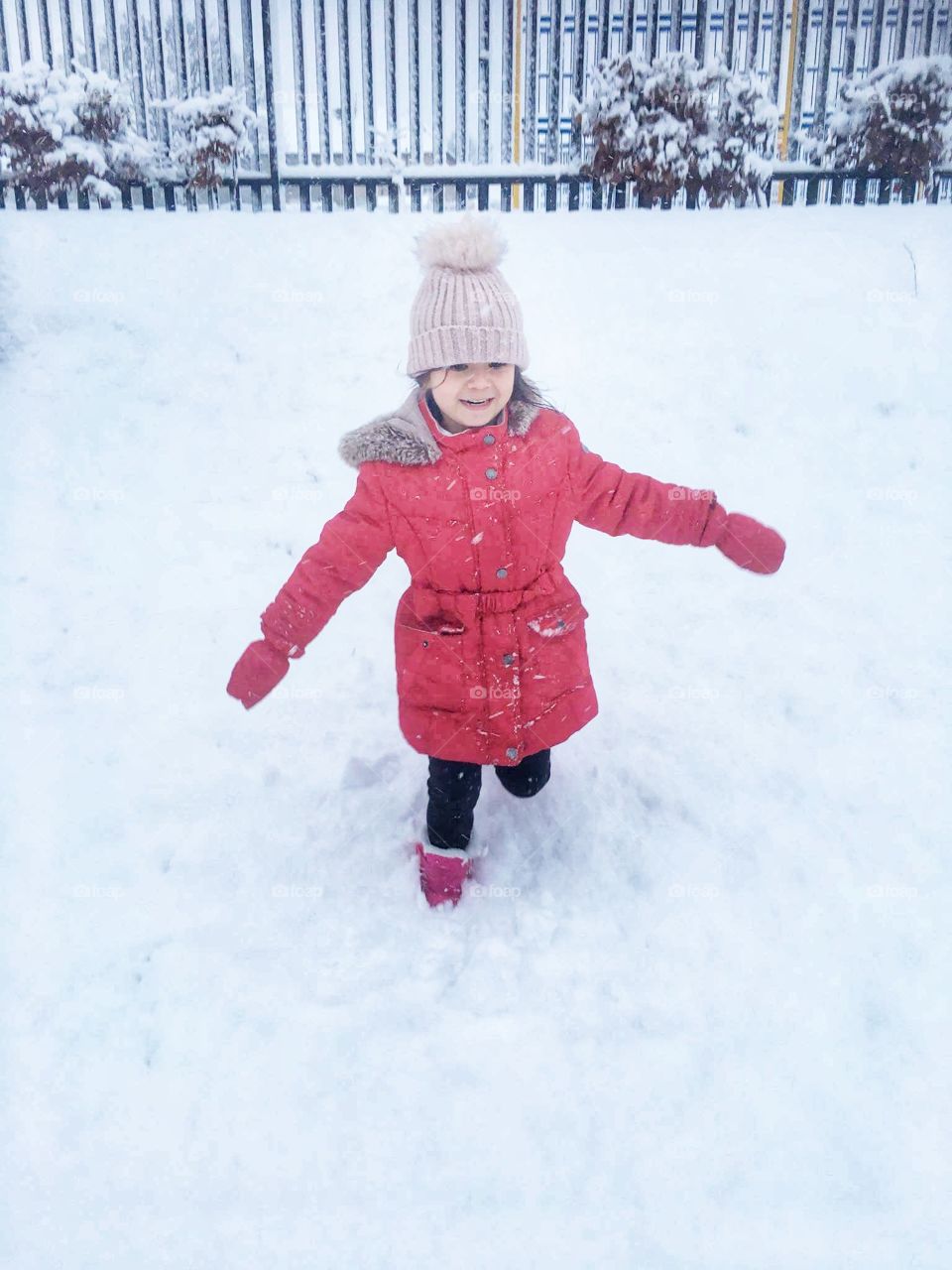 Children funning with snow