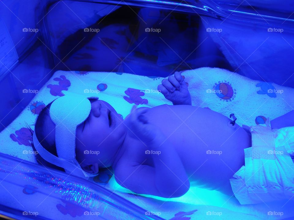 Newborn Under Ultraviolet Lights
