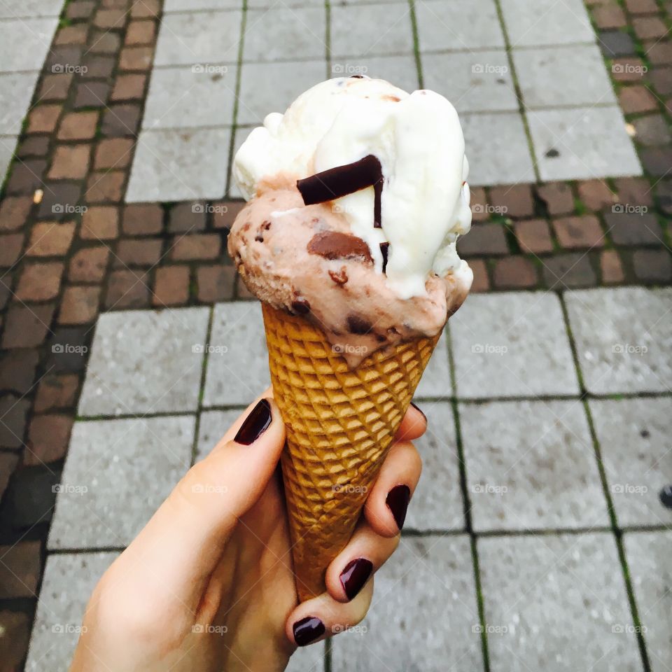 Woman hand holding a ice cream cone