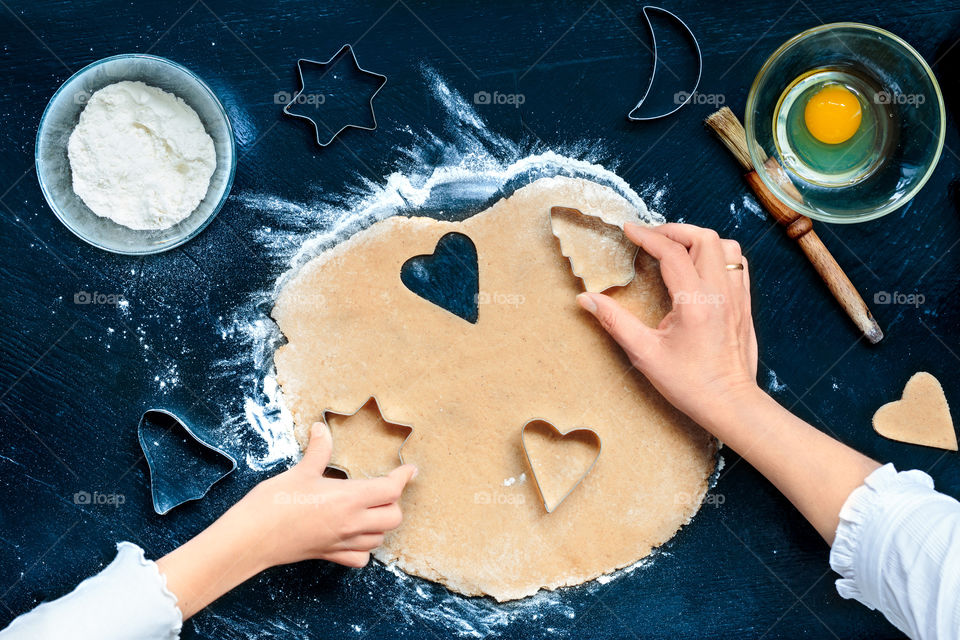 Various shape cookies cut out with different cutters