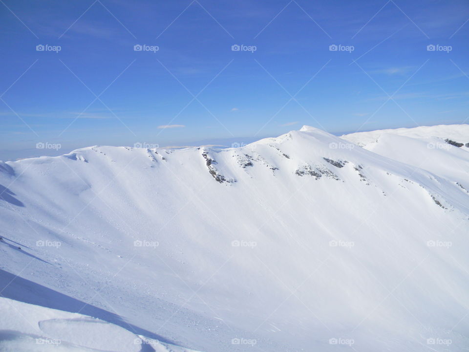 snow sun mountain