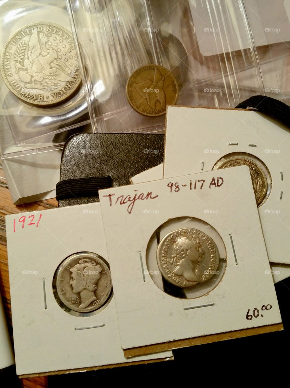 old silver coins in holders