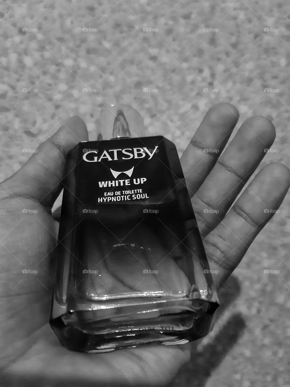 a perfume bottle in a hand named Gatsby as one of popular products in Indonesia
