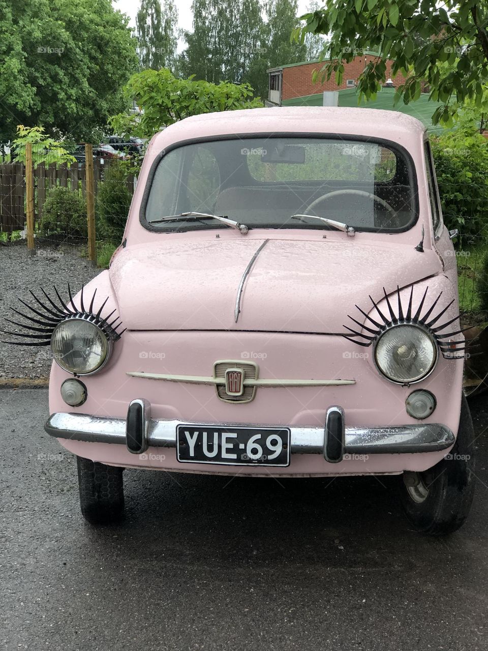 Pink Fiat with eye lashes 