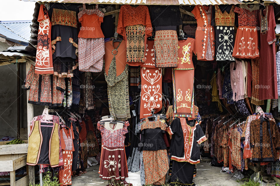 Traditional clothings hanging in a stall in Malaysia