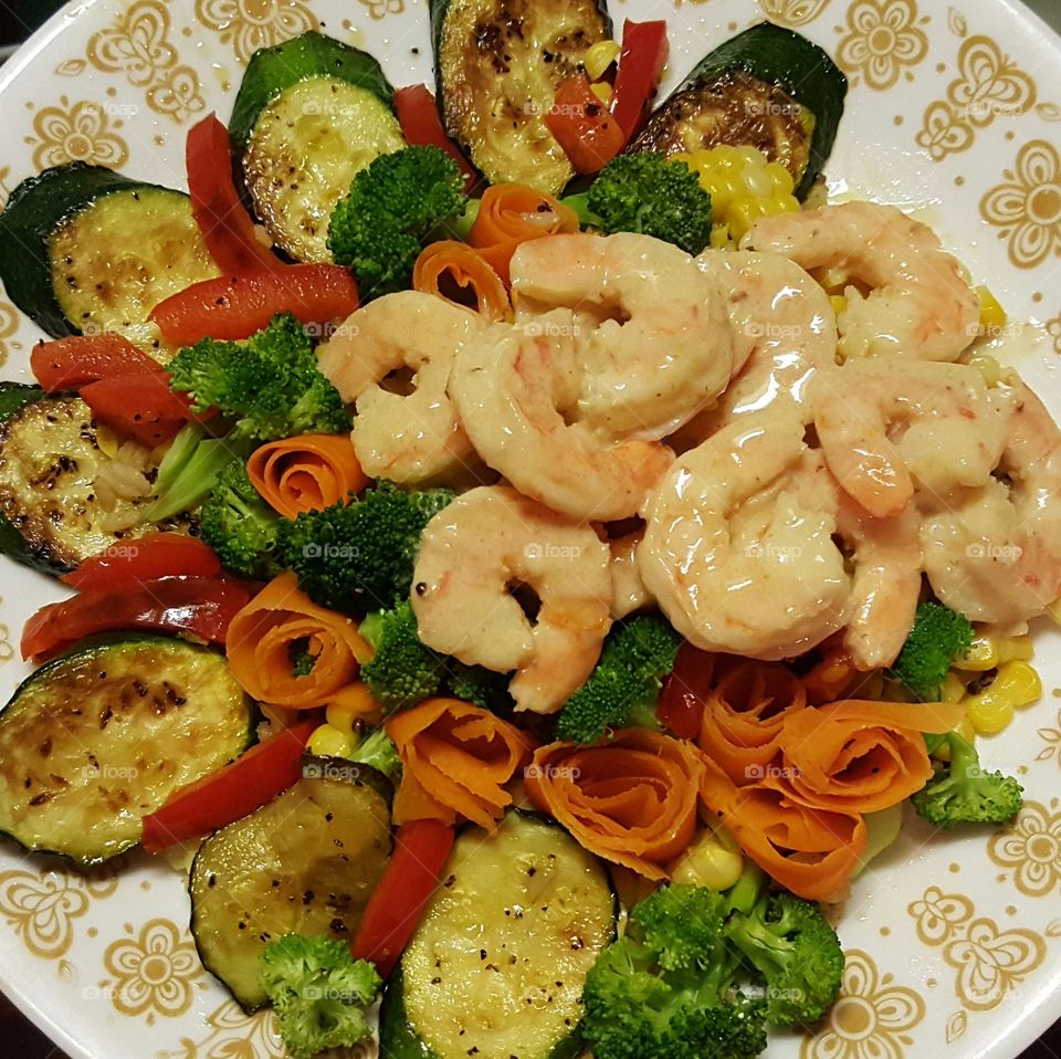 Shrimp, zucchini, broccoli, carrots, corn, and red bell peppers