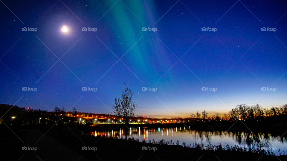 Sunset with the coming of the Northern Lights, Fort McMurray, Alberta, Canada