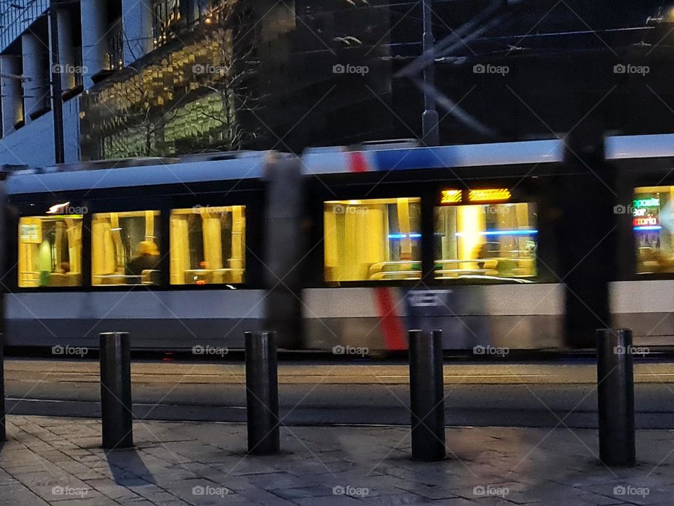 The tram in Rotterdam city by evening