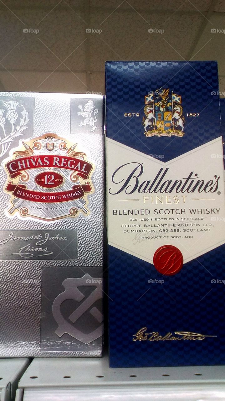 Bottle with scotch in cardboard boxes