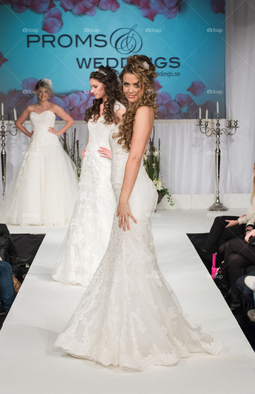 Fashion show at a wedding fair. Here are the latest dresses and clothes for both bride and groom.