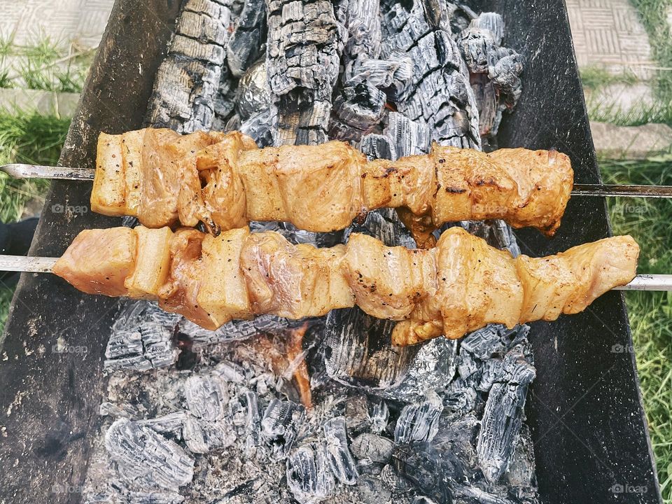 Cooking meat on the brazier