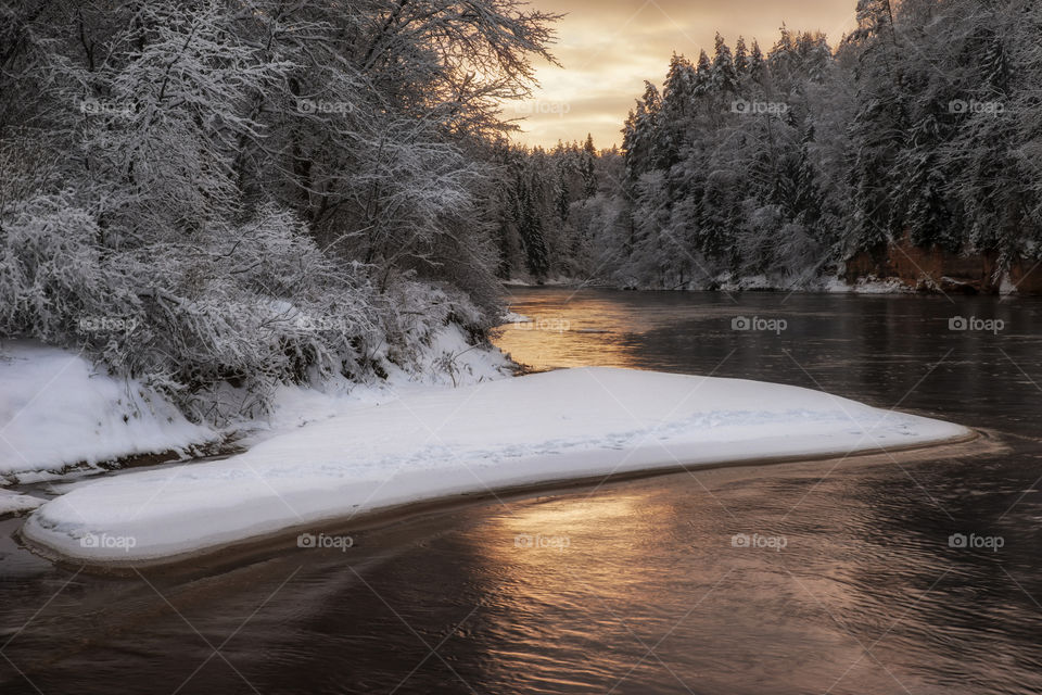 Snow. River. Sunset.