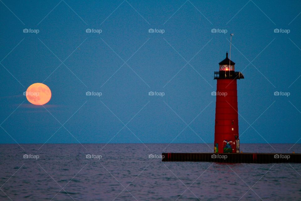 Full moon rising over the harbor
