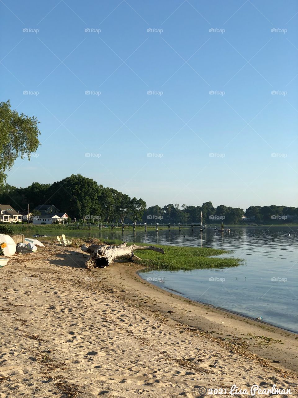 On the sandy shoreline, overlooking the ocean on private beach front property at sunrise, in Warwick, RI. Peaceful scenic view, calm, tranquility.