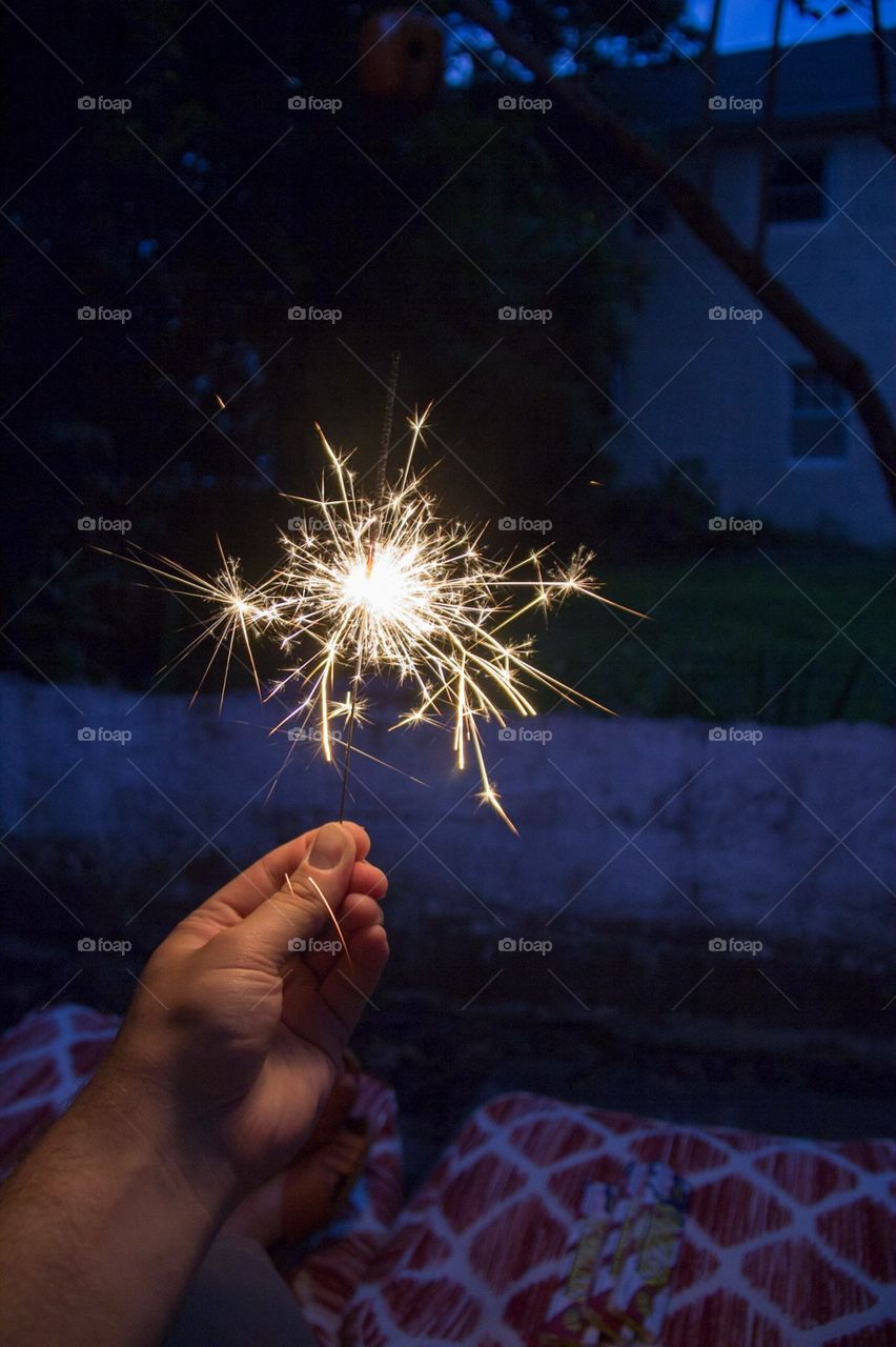 holding sparklers July 4