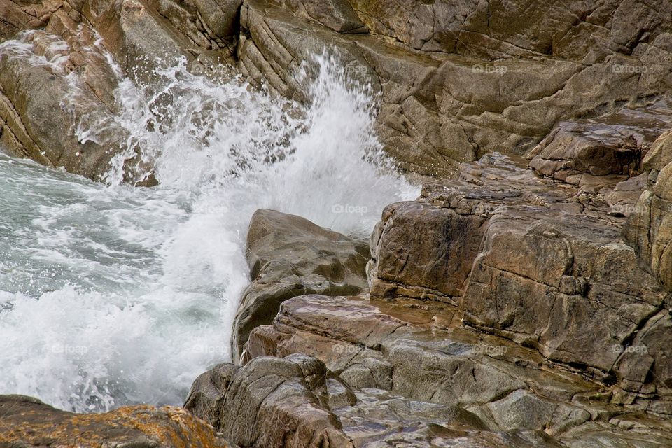 water flowing into the rocks