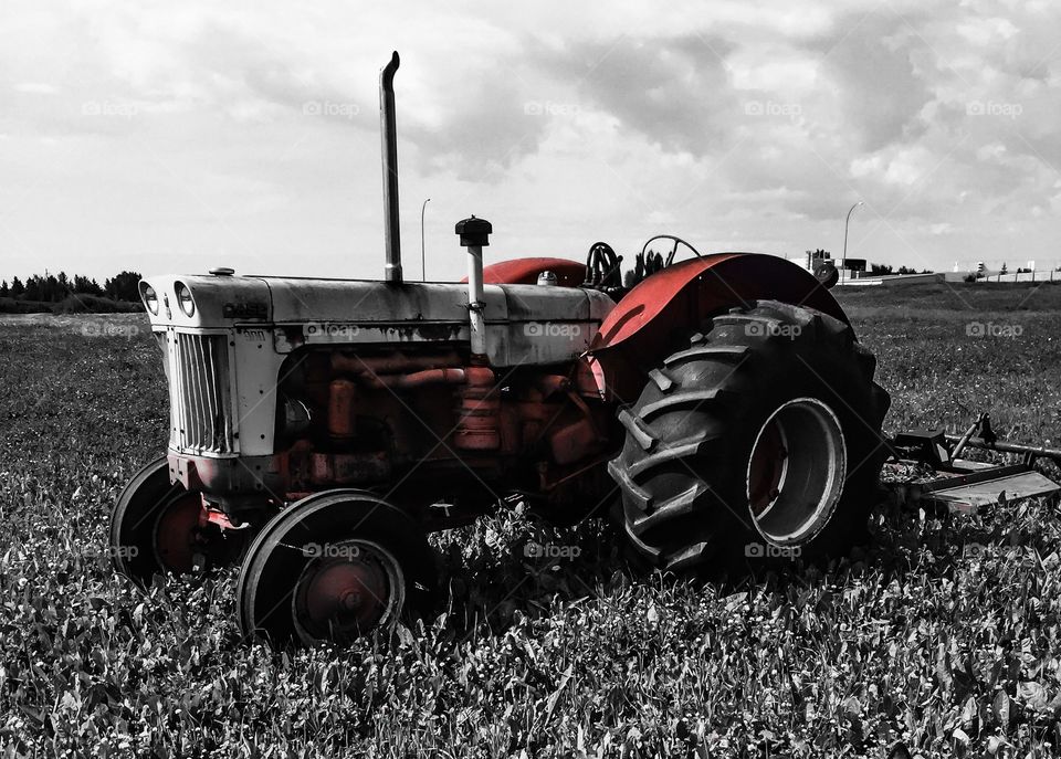 Stationary tractor in field