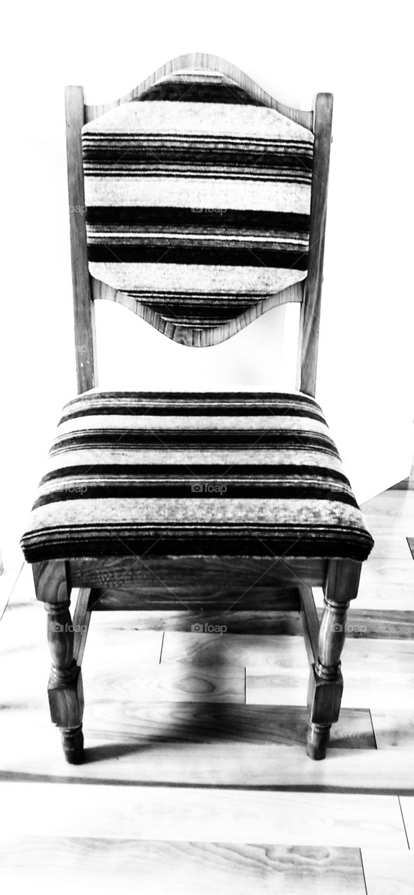 Wooden chair in front of the room