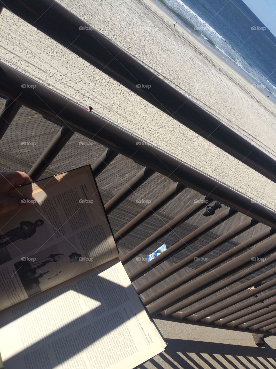 Reading a book in Long Beach, NY