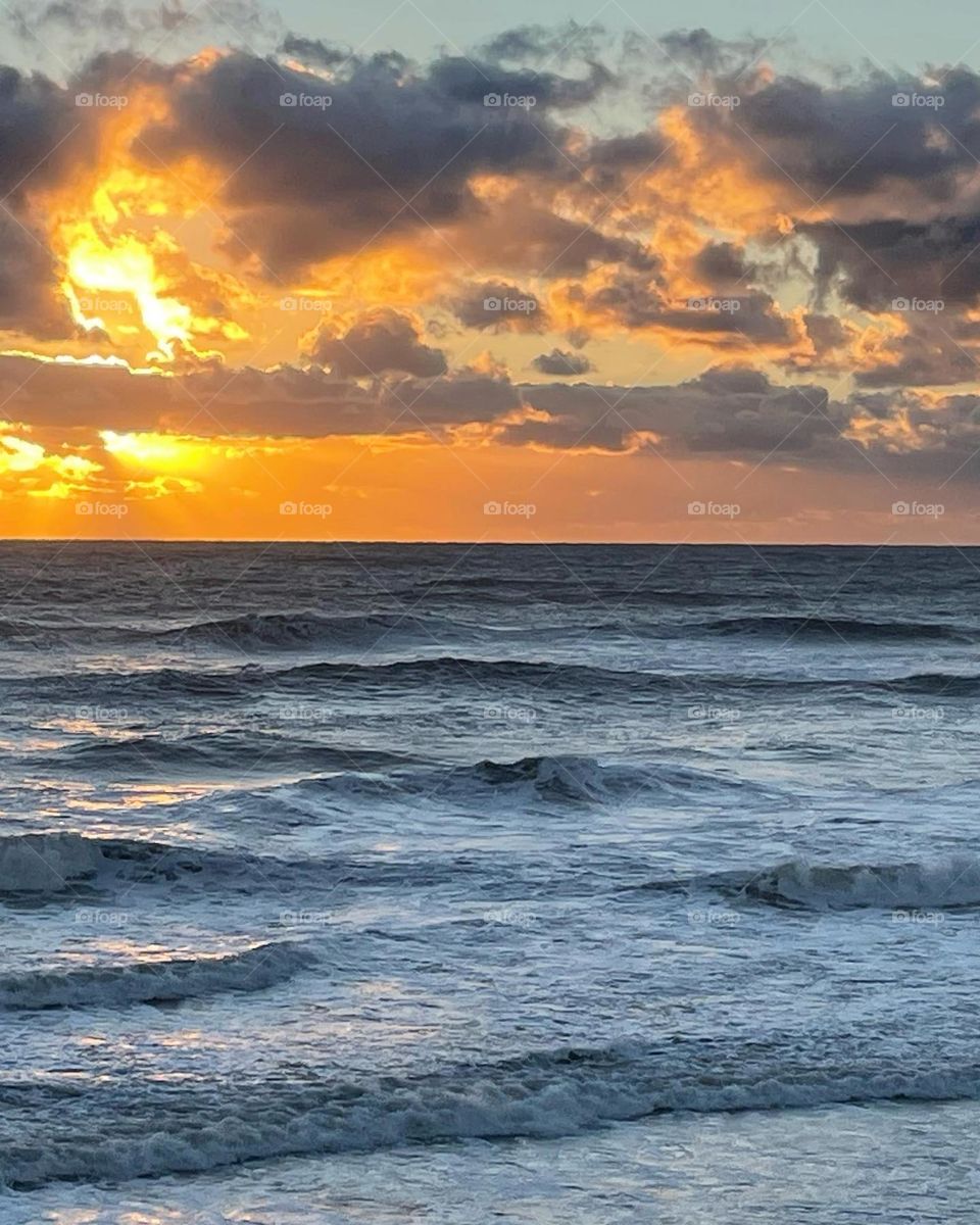 Golden Sunrise and Waves