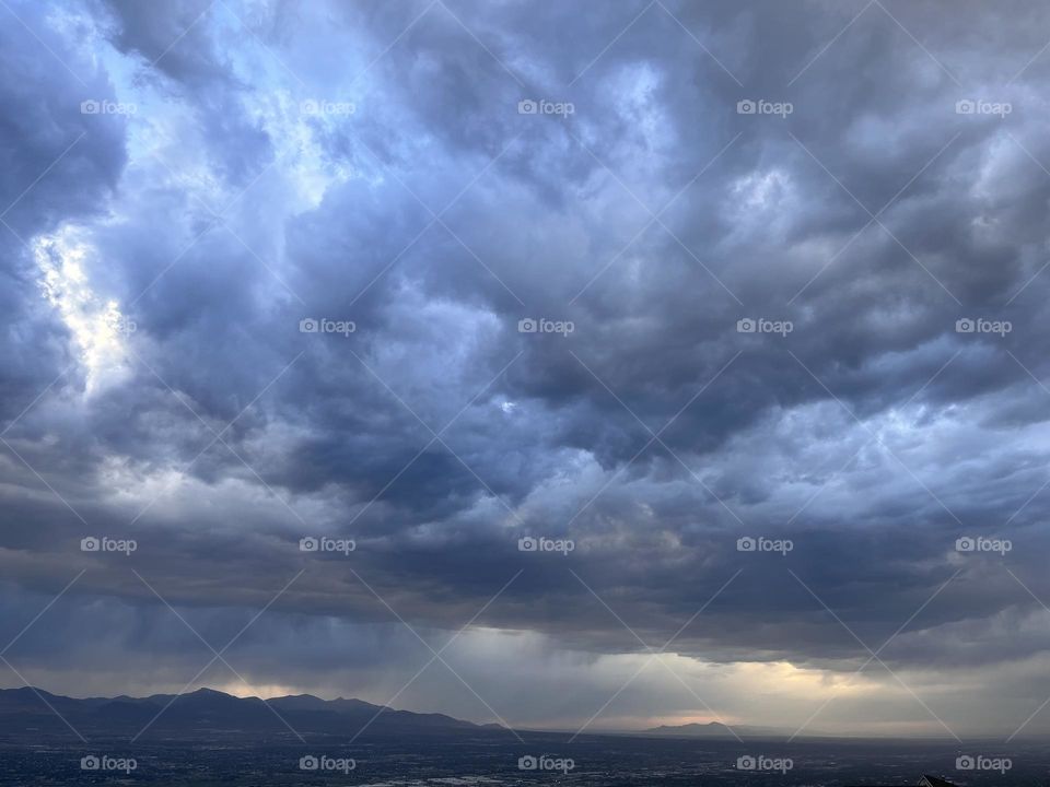 Watching a dramatic thunderstorm pass over the valley at the end of springtime 