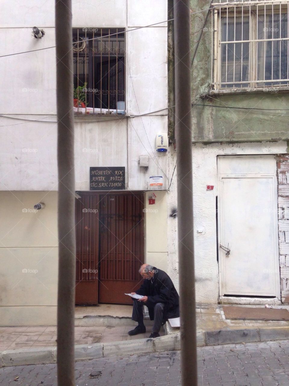 Man sitting near the door 