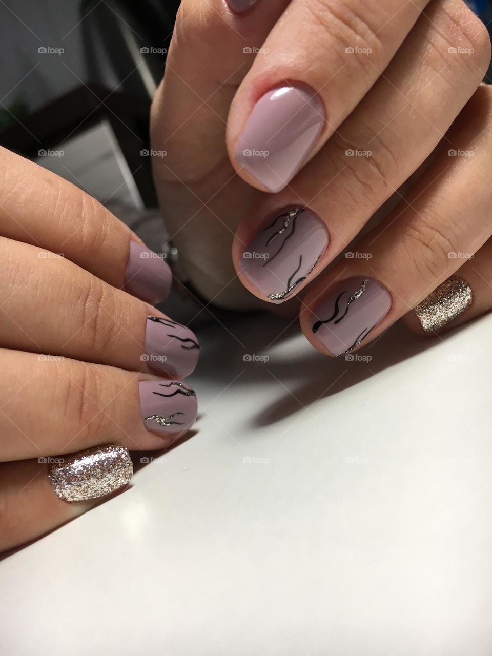 Painted nails, gel polish on nails, women's beautiful and neat manicure