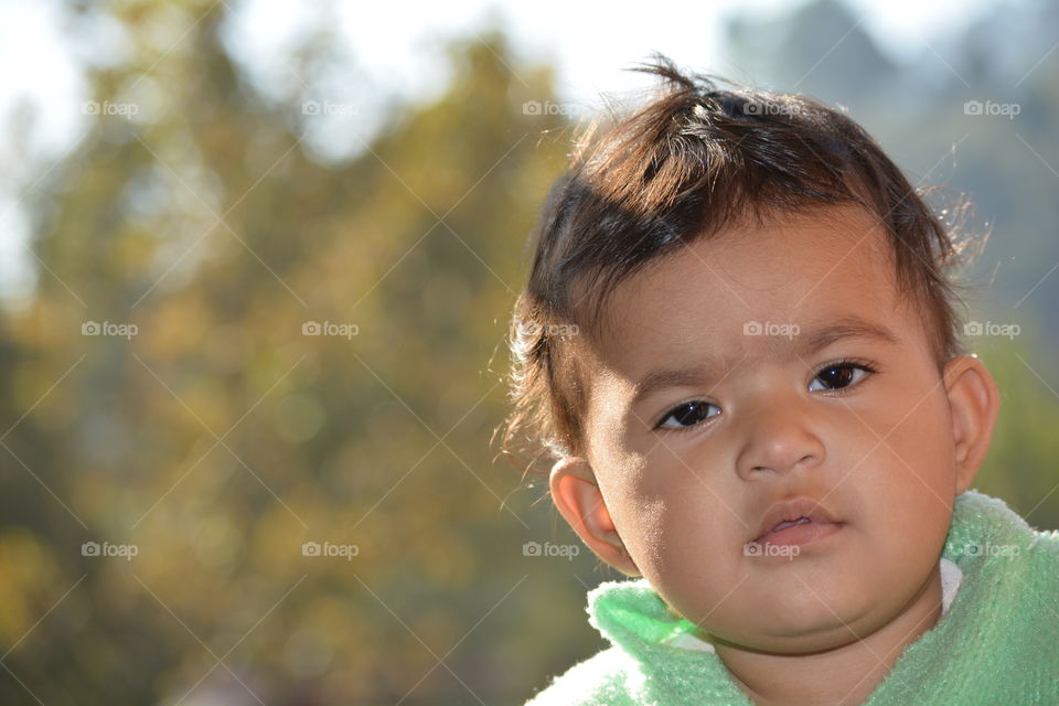 Portrait of little boy looking at camera