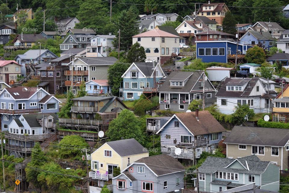 Homes cling to a hillside in Ketchikan Alaska and host a variety of styles and colors