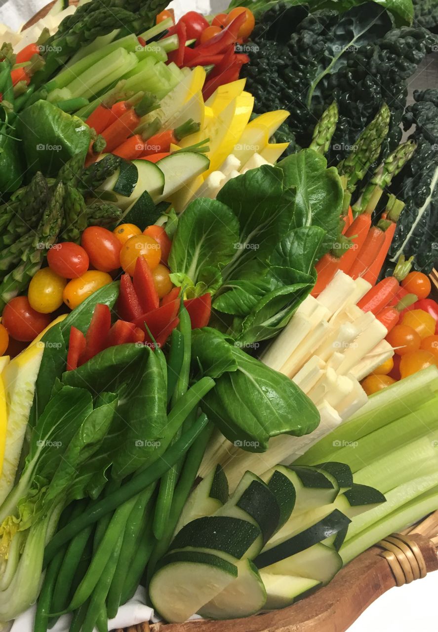Crudité basket of Zucchini, Squash, Hearts of Palm, Plum Tomatoes, Bok Choy, Kale, Baby Carrots and Asparagus
