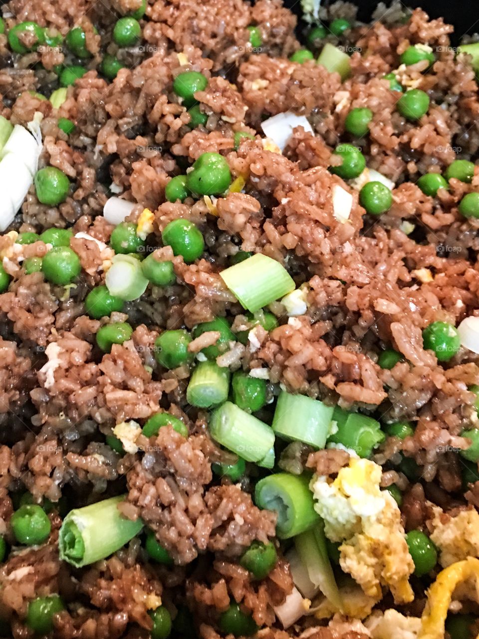 Chinese fried rice closeup in cooking pan