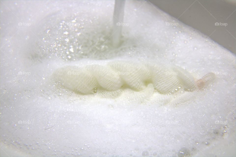 Pouf Floating in Bubbles With Flowing Water